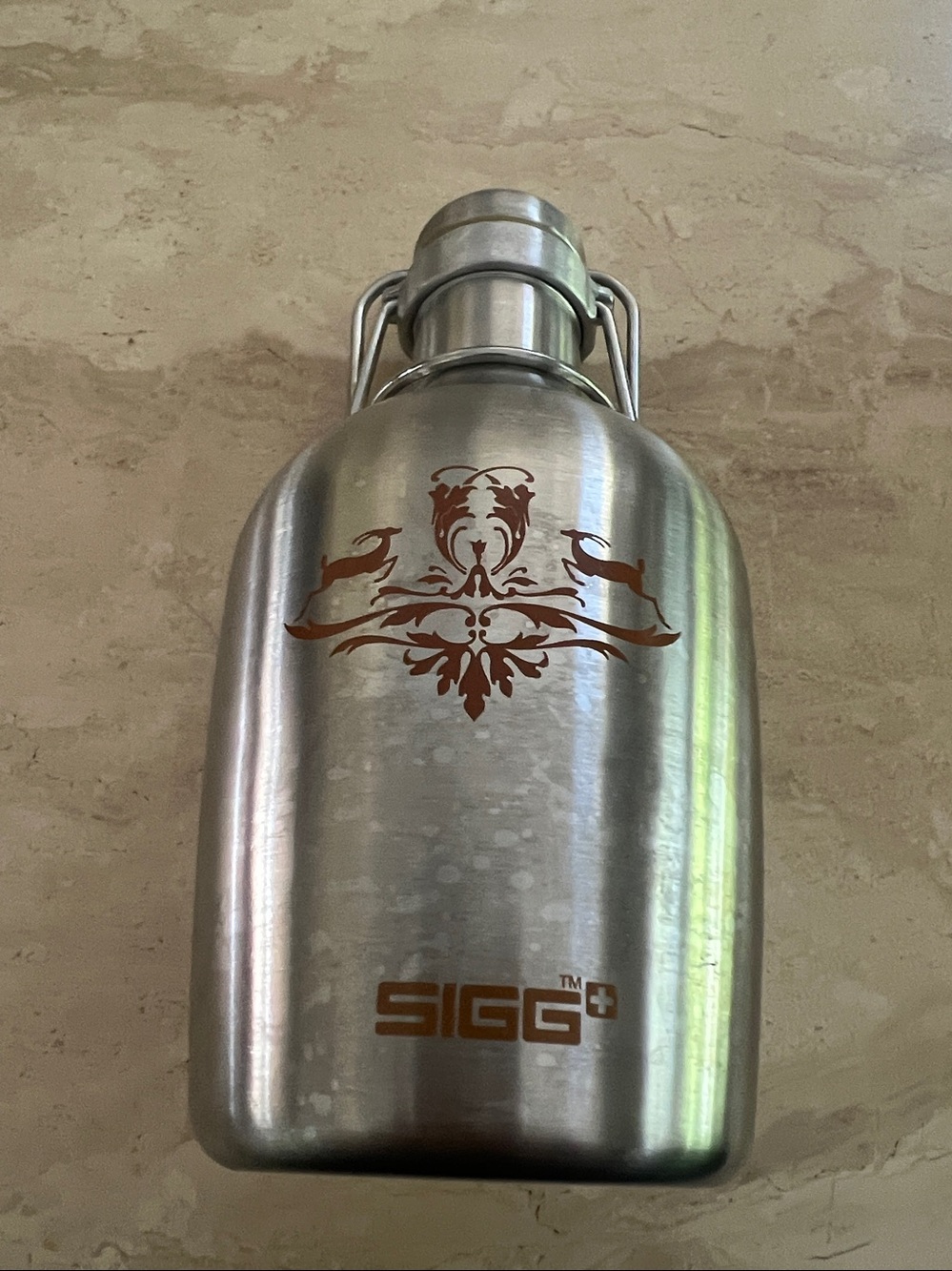 SIGG Stainless Steel Flask with Decorative Crest 7”high 0.4-liter Flip Top Lid